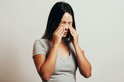 Sinusitis Woman feeling in pain with sinusitis